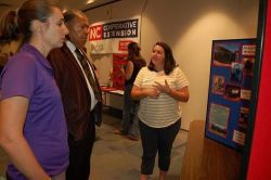 Agent L. Elmore speaks with 2 others